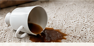Spilled coffee on a cream carpet
