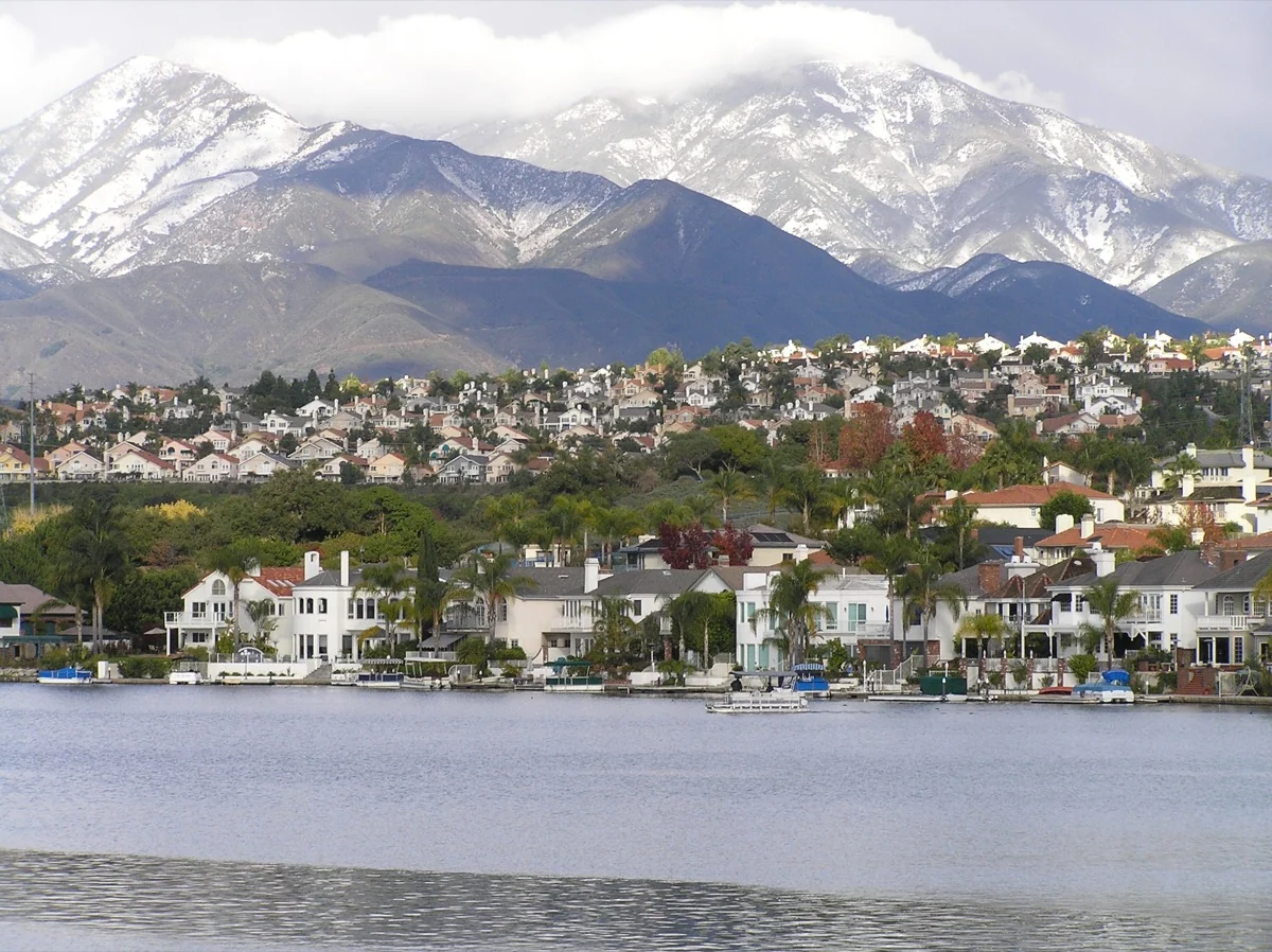 Lake Mission Viejo homes beneath snow-dusted Saddleback Mountain